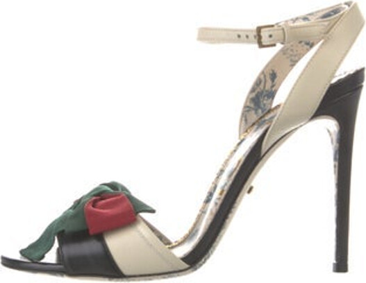 Gucci Leather Sandals Neutrals Web Accent Bow Accents Buckle Closure at Ankles Includes Box & Dust Bag Unfortunately, due to restrictions, this item may not be eligible for shipping in all areas.