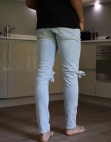 Thumbnail for your product : Topman skinny jeans with extreme rips in light wash blue