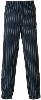 Andrea Crews striped track trousers