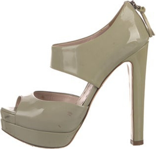 Miu Miu Patent Leather Slingback Sandals Neutrals Leather Trim Embellishment & Leather Trim Platform Exposed Zip Closure at Sides Includes Dust Bag Size not listed, estimated from measurements.