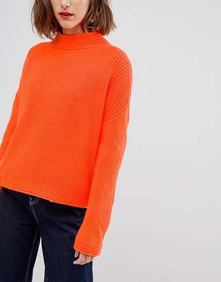 ASOS Design DESIGN neon sweater with stitch sleeve detail