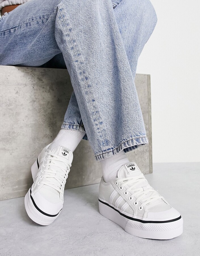 adidas Nizza platform sneakers in off-white with black piping - ShopStyle