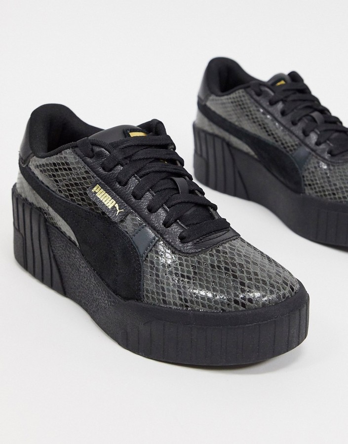 Puma Cali Wedge sneakers in black snake - ShopStyle