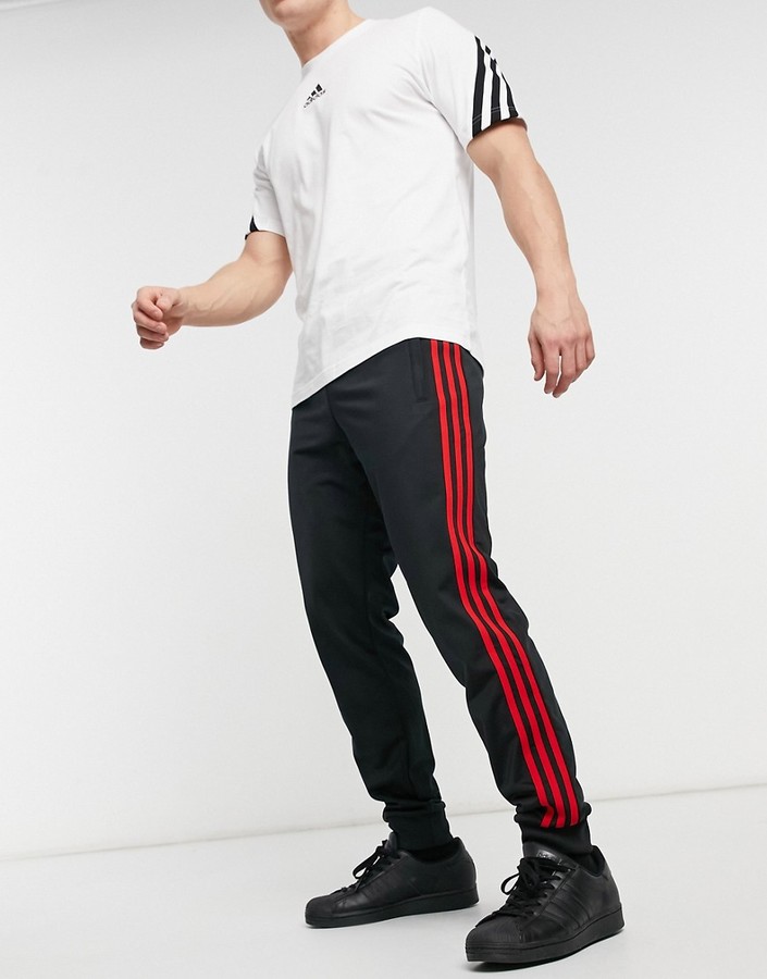 adidas 3-Stripes Firebird sweatpants in black and red - ShopStyle  Activewear Pants