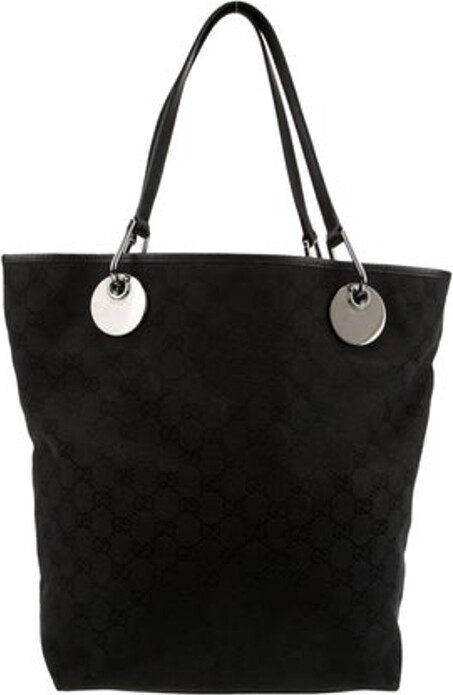 Gucci Tote Black Canvas GG Canvas & Eclipse Insignia Gunmetal Hardware Leather Trim Dual Shoulder Straps Leather Trim Embellishment Nylon Lining & Dual Interior Pockets Open Top Protective Feet at Base