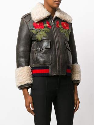 Gucci embroidered shearling lined bomber jacket