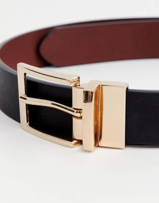 ASOS Design DESIGN faux leather slim reversible belt in black and brown with gold buckle