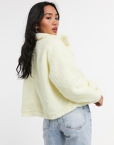 Thumbnail for your product : ASOS DESIGN Petite fleece cropped jacket in pale yellow