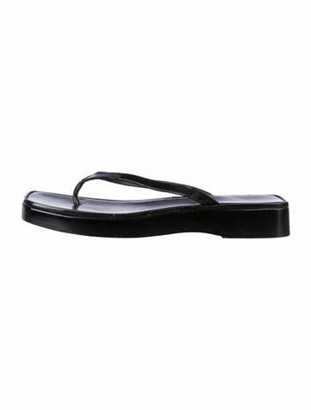black patent leather flip flops