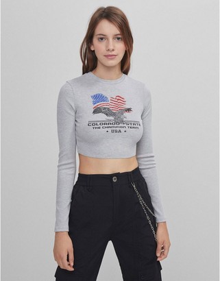 Bershka long sleeve crop top with eagle graphic in gray - ShopStyle