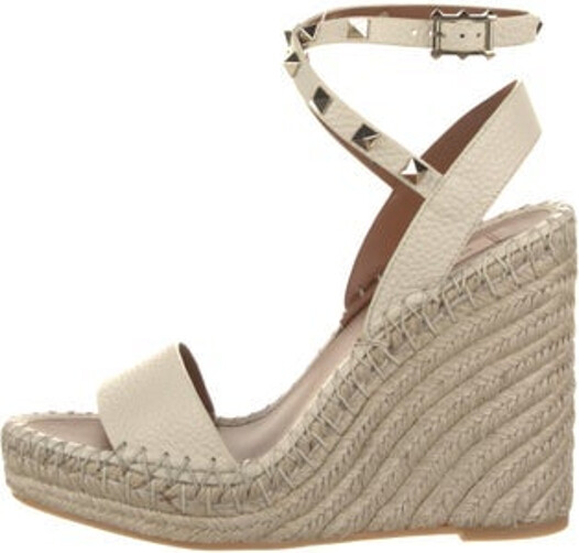 Valentino Leather Espadrilles Neutrals Studded Accents & Jute Trim Platform Wrap-Around Straps & Buckle Closure at Ankles Includes Box & Dust Bag Unfortunately due to restrictions this item may not be eligible for shipping in all areas.
