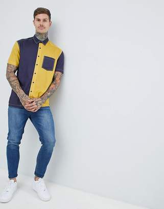 ASOS DESIGN regular fit cut & sew shirt in navy & mustard