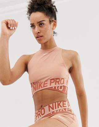 Nike Training crossover tank in rose gold