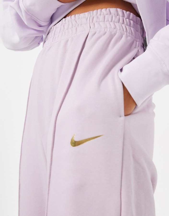 Nike mini metallic swoosh oversized purple joggers - ShopStyle ...