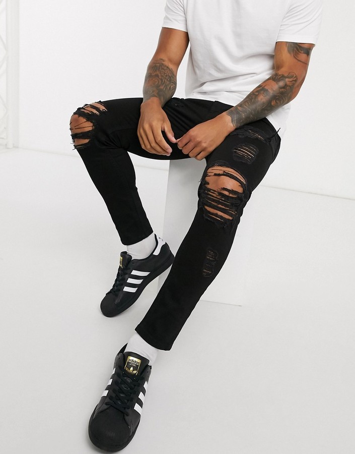 ASOS DESIGN cropped skinny jeans in black with heavy rips - ShopStyle