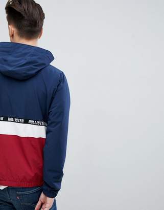 Hollister lightweight hooded jacket colourbock taping and seagull logo in navy/red