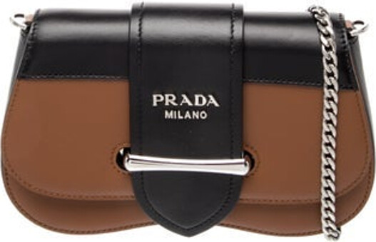 Prada Crossbody Bag Nero City Calf Leather Signature Logo Silver-Tone Hardware Chain-Link Handle & Chain-Link Shoulder Strap Chain-Link Accents Unlined & Single Interior Pocket Flap Closure at Front Includes Dust Bag Unfortunately, due to restrictions, this item may not be eligible for shipping in all areas.