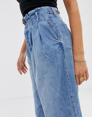 Free People pleated high rise carrot jeans