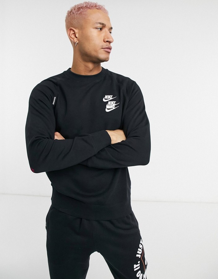 Nike World Tour Pack graphic crew neck sweatshirt in black - ShopStyle
