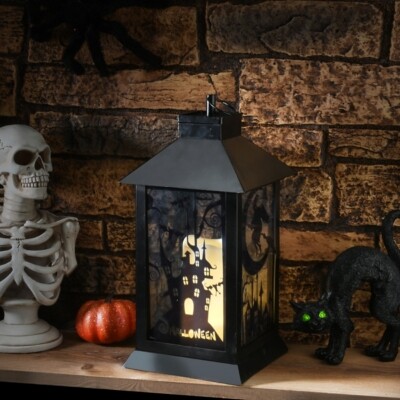 https://img.shopstyle-cdn.com/sim/fc/9b/fc9ba05e7c75105058edf41b1e4f9608_best/national-tree-company-16-black-halloween-haunted-house-lantern-with-battery-operation.jpg