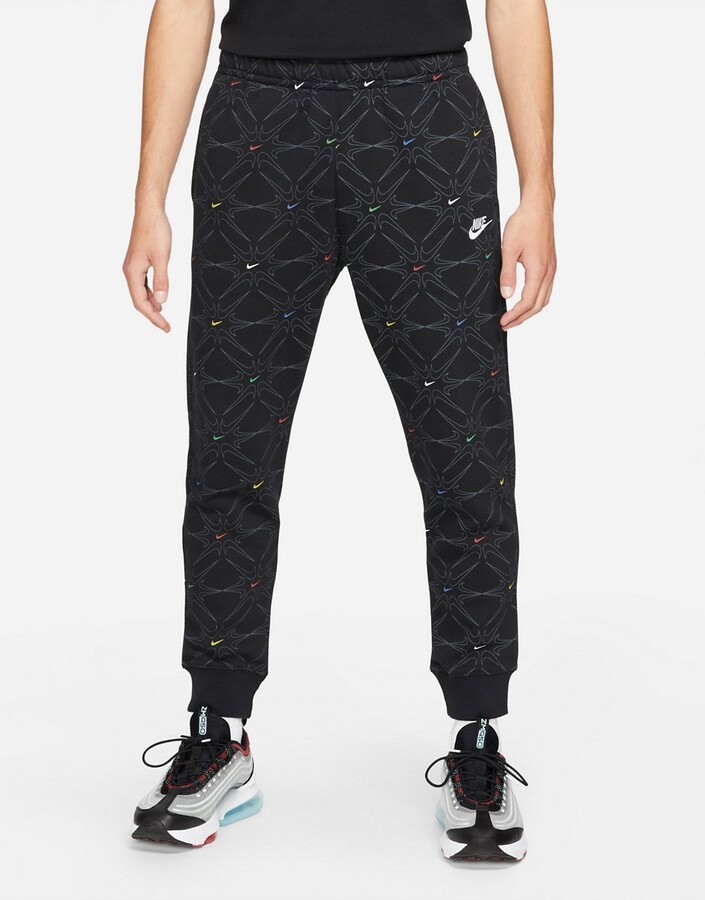 Nike Branded AOP Pack all over logo cuffed sweatpants in black/multi -  ShopStyle Activewear Pants