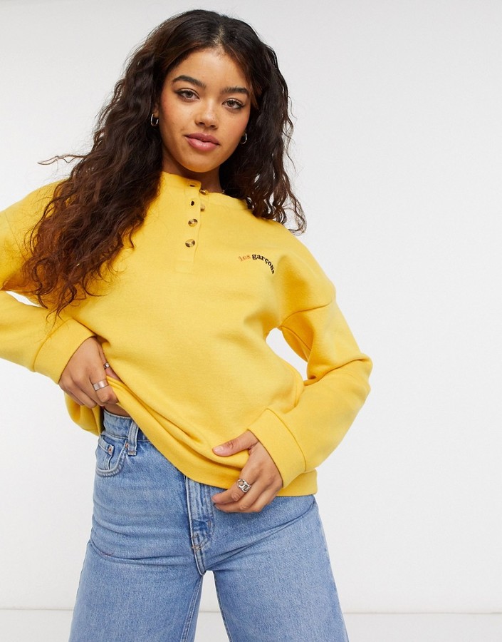 yellow button up sweater