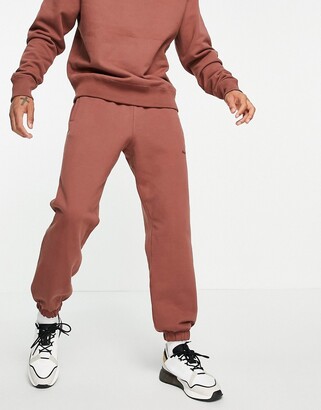Outward Summit Infer adidas x Pharrell Williams premium sweatpants in burgundy - ShopStyle Pants