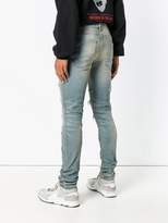 Thumbnail for your product : Amiri snake patch distressed jeans