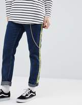 Thumbnail for your product : ASOS Design Slim Jeans In Indigo With Side Stripe Text