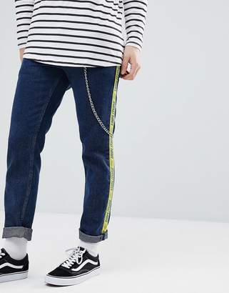 ASOS Design Slim Jeans In Indigo With Side Stripe Text