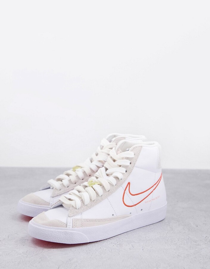Nike Blazer Mid 77 SE S50 trainers in white and orange - ShopStyle