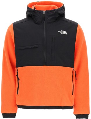 orange north face sweatshirt