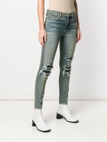 Thumbnail for your product : Amiri Ripped Detailed Jeans