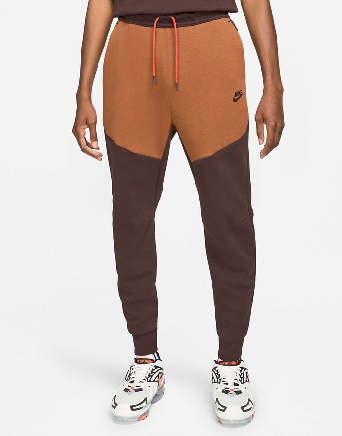 Nike Tech Fleece color block sweatpants in dark brown/tan - ShopStyle  Activewear Pants