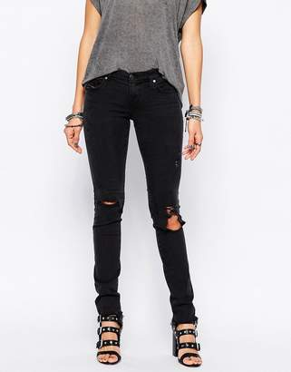 Diesel Skinzee Low Rise Super Skinny Jeans With Distressing