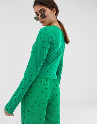 Monki long sleeve tie front top in green triangle polka dots