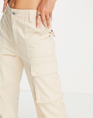 Bershka Petite pocket detail slim leg cargo pants in light beige