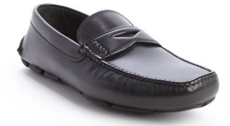 Prada black leather moc toe penny loafers