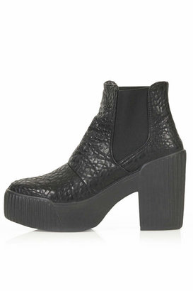 Topshop Chunky chelsea boots. heel heigh approximately 4". 100% polyurethane.