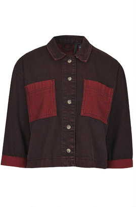 Topshop Relaxed fit denim shirt in a red overdye wash. features full length button placket, contrast pockets and rolled up sleeve cuffs. match it up with a pair of baggy jeans