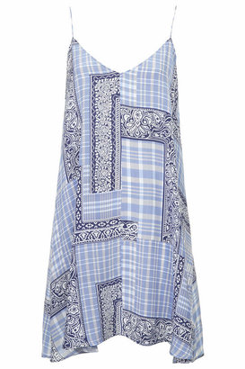 Topshop Silk patchwork slip dress cut in a swing silhouette with skinny straps. team with clunky sandals