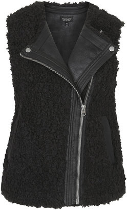Topshop Bonded borg gilet in boxy shape with faux leather epaulette edging and front pockets. 59% acrylic, 41% polyester. machine washable.