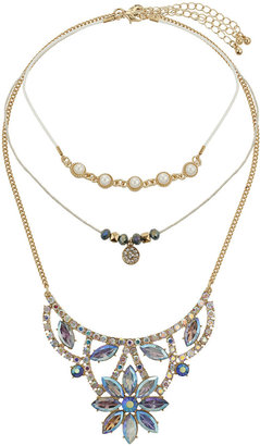 Topshop Freedom at 100% metal. Necklace multi-pack including pearls on a white cord choker, a facet bead ditsy necklace and a statement rhinestone necklace with blue rhinestones. can be worn together or separately. longest length 8.5 inches with 2 inch extension chain.