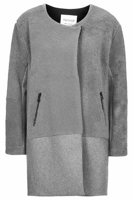 Topshop Open front slouchy coat with contrast lower panel and heavy duty zipped pocket detailing. made in britain. length - 87cm. 80% wool, 10% cashmere, 10% polyamide. specialist dry clean only.