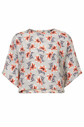 Topshop Boutique. made in britain. 100% silk. dry clean only. Silk tee with all-over floral print and button fastening to the back of the neck.