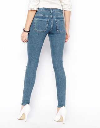 ASOS Whitby Low Rise Skinny Jeans in Rosebowl Mid Wash Blue with Busted Knees