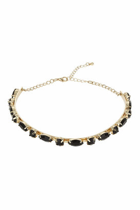 Topshop Freedom at 100% metal. Gold-look curved bar choker with jet black opaque stones, width 4.75 inches with 2.5 inch extension chain.