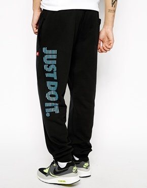 Nike AW77 Cuffed Sweatpants With Just Do It Logo - black