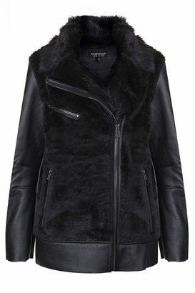 Topshop Faux fur bonded biker jacket with contrast faux leather sleeves and silver trims. 100% polyurethane. dry clean only.