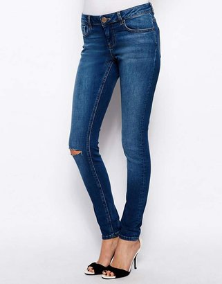ASOS Whitby Low Rise Skinny Jeans in Arizona Dark Wash Blue with Ripped Knee - Busted blue